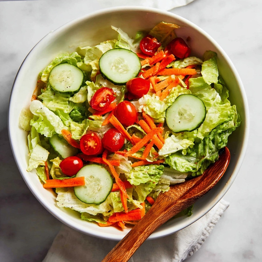 Fresh Garden Salad with Cherry Tomatoes, Cucumber, and a Tangy Vinaigrette Recipe - Recipe Image