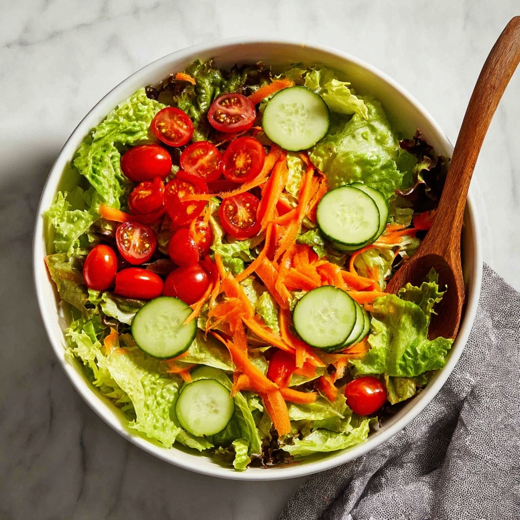 Fresh Garden Salad with Cherry Tomatoes, Cucumber, and a Tangy Vinaigrette Recipe - Recipe Image